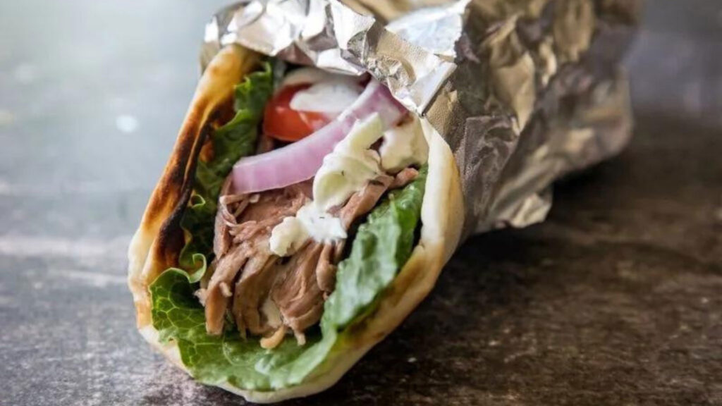 A Traeger smoked lamb Gyro wrapped partly in foil.