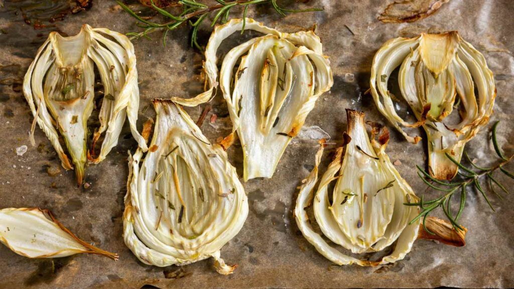 Sliced and grilled fennel on parchment.