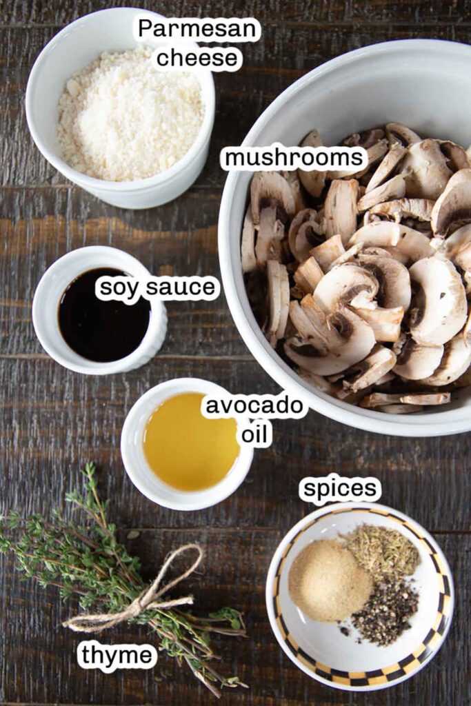 Individual ingredients in small bowls on a wood surface.