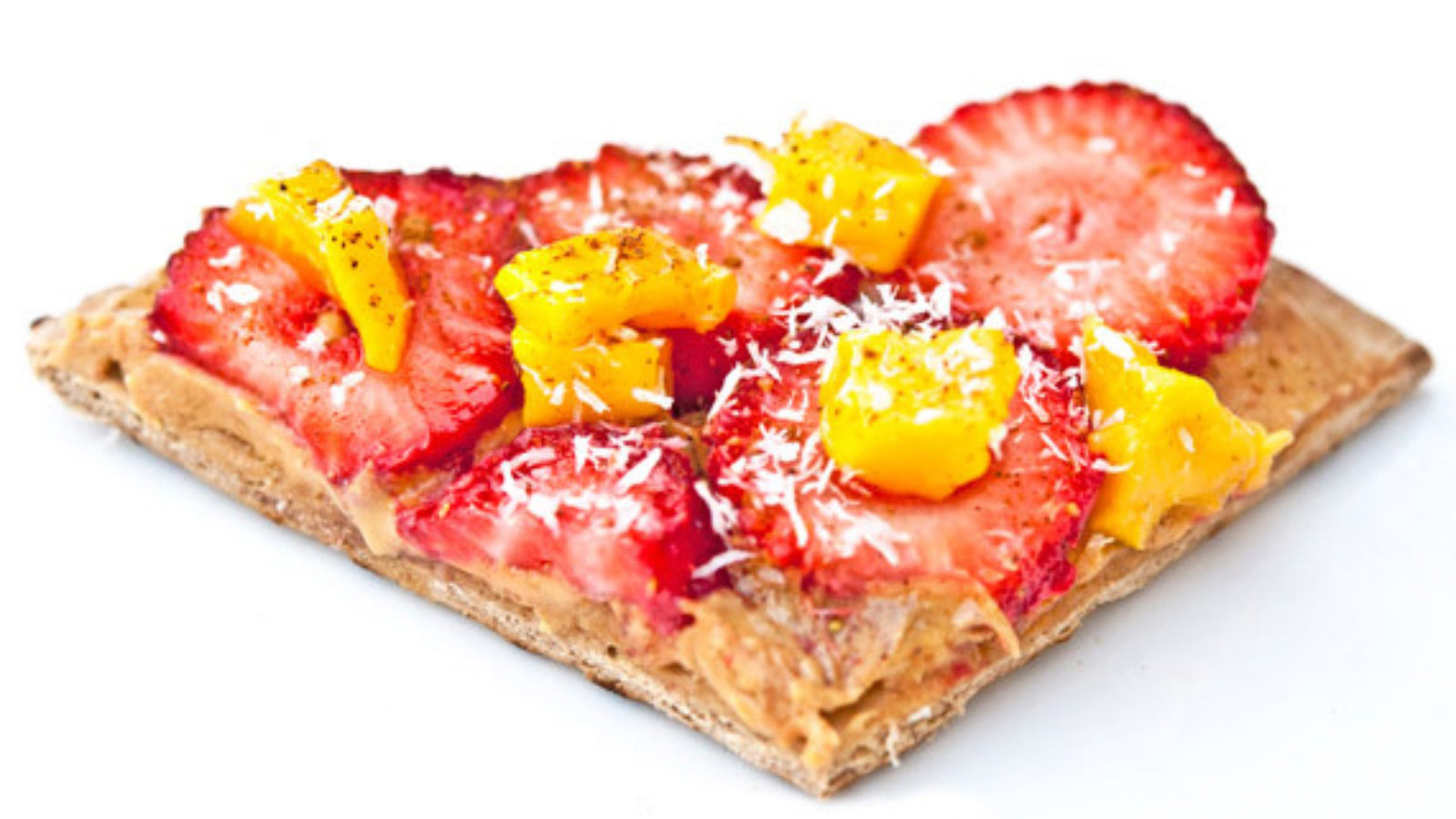 A single slice of fruit pizza on a white background.