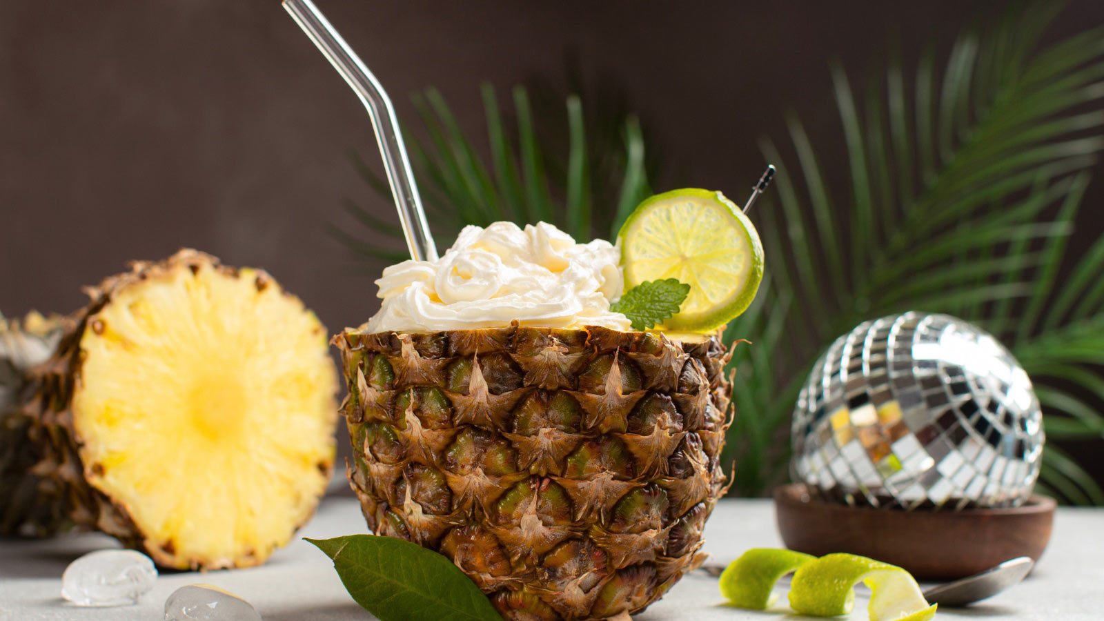 Refreshing pineapple whip in half of a ripe pineapple.