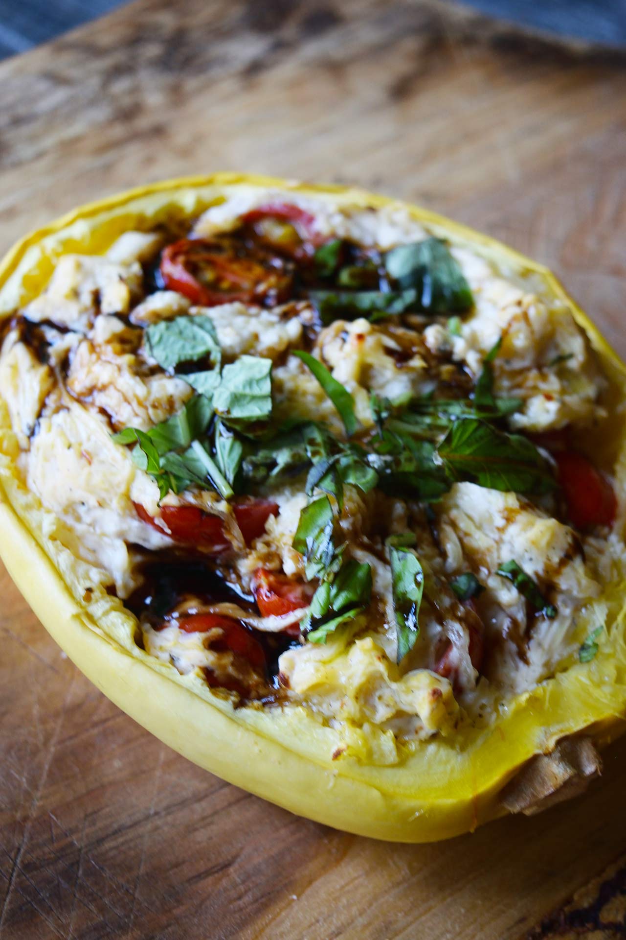 Creamy Stuffed Spaghetti Squash Recipe with Tomatoes, Basil, and