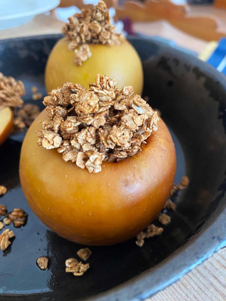 Front view of baked apple in a skillet.